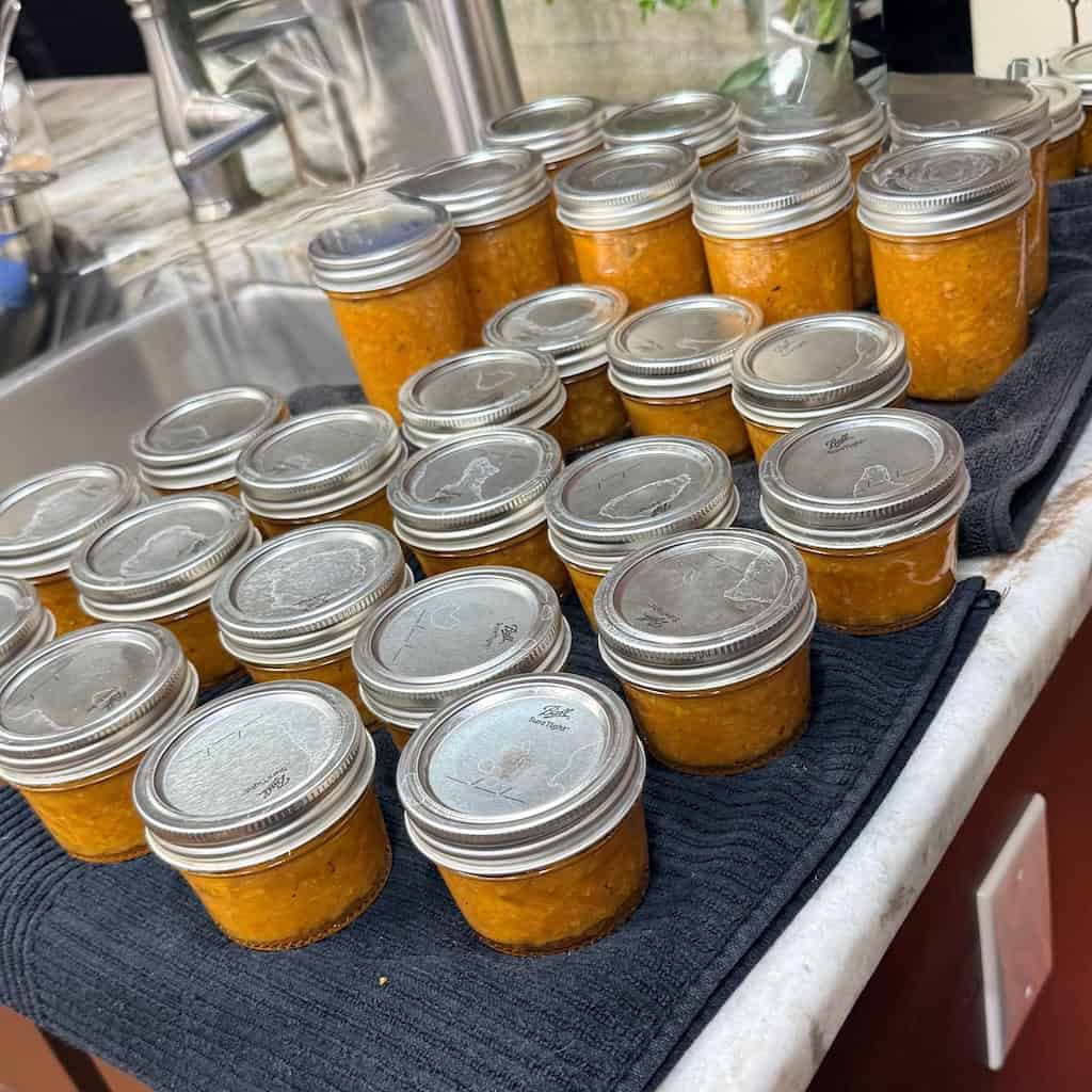 Quarter and half pint mason jars filled with loquat jam