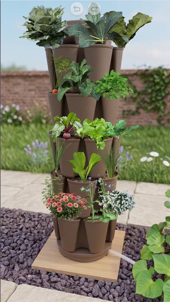 Sample Greenstalk garden layout with 5 tier vertical planter filled with vegetable plants